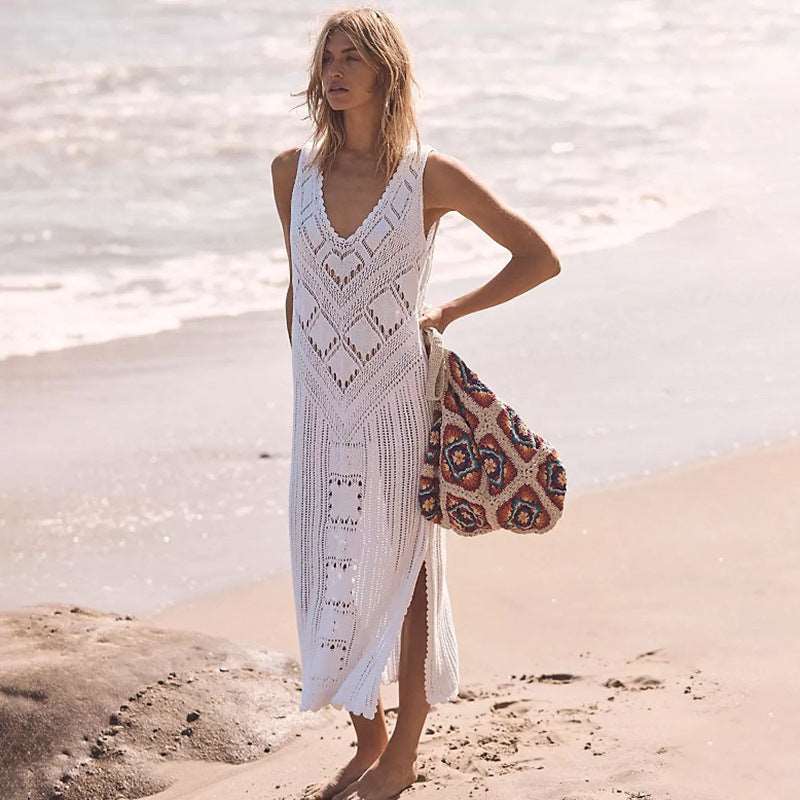 a woman walking on the beach with a surfboard 