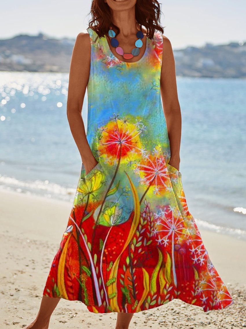 a woman in a colorful dress carrying a surfboard 