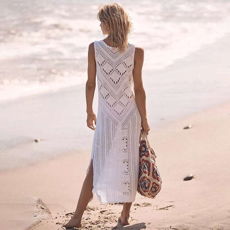 a woman walking on the beach with a surfboard 